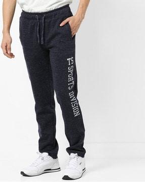 speckle patterned track pants with typography