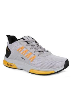 sports shoes with lace fastening