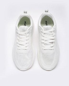 sports shoes with lace fastening