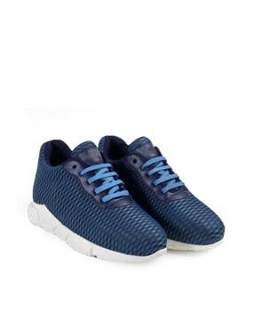 sports shoes with lace fastening