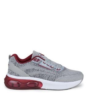 sports shoes with lace fastening