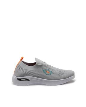 sports shoes with lace fastening