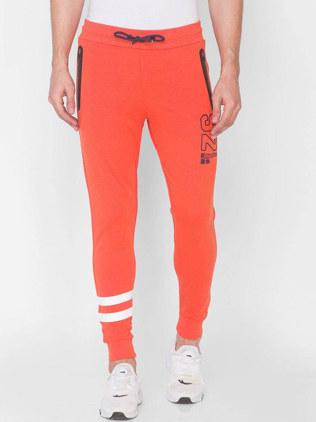 spykar men orange coloured solid slim-fit cotton joggers
