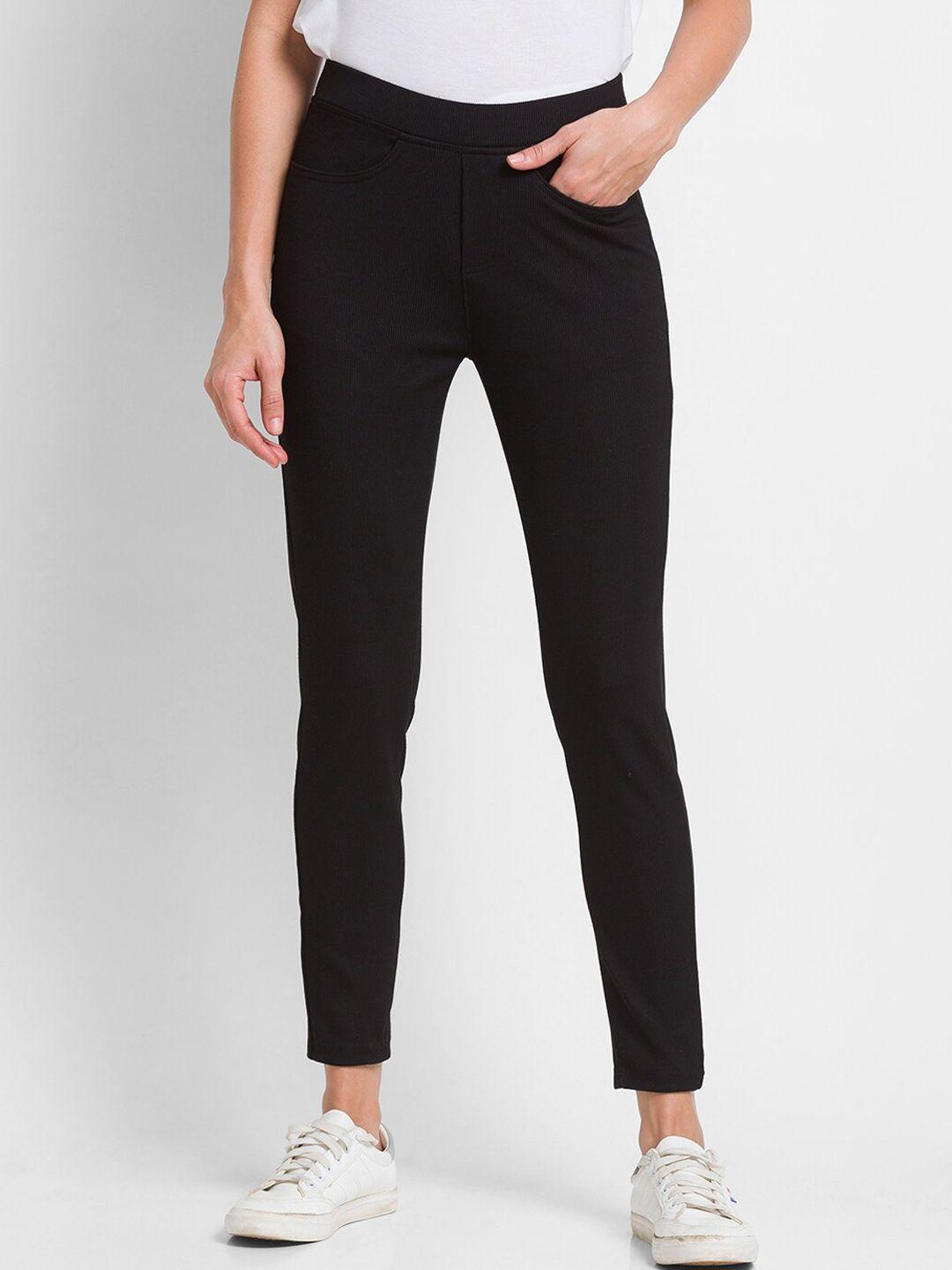 spykar women black solid cotton slim-fit track pants
