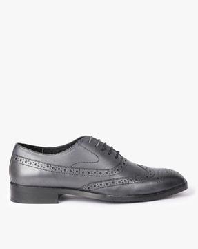 stacked heel perforated brogues