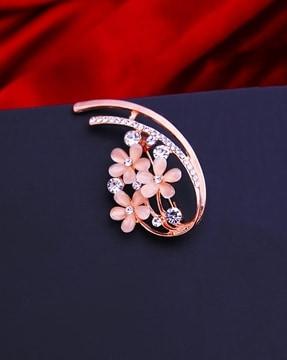 stone-studded floral brooch
