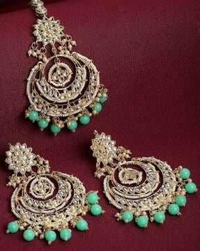 stone-studded maang tika with earrings