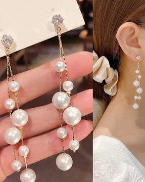 stone-studded pearl drop earrings
