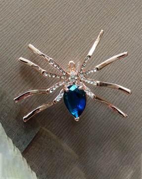 stone-studded spider brooch