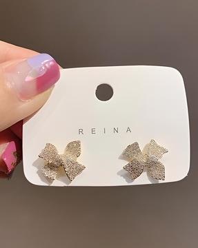 stone-studded stud earrings