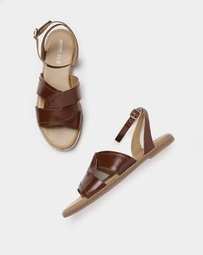 strappy flat sandals with buckle closure