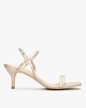 strappy heeled sandals with buckle fastening