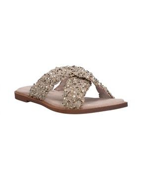 strappy slip-on flat sandals with metal rivets