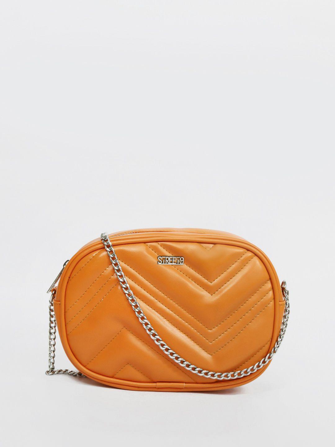 street 9 orange quilted sling bag