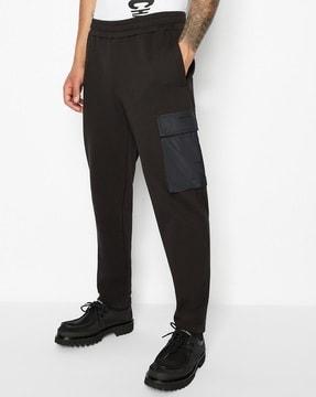 stretchable track pants with cargo pockets