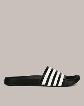 striped open-toe slides