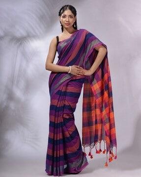 striped saree with contrast border and tassels