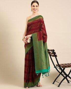 striped saree with contrast border and tassels