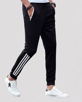 striped track pants with zipper pockets