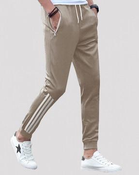 striped track pants with zipper pockets