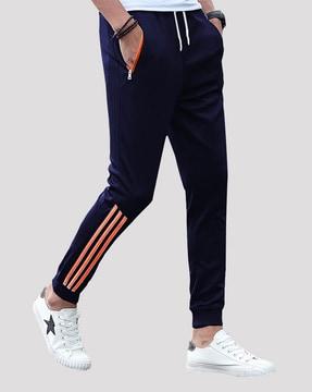 striped track pants with zipper pockets