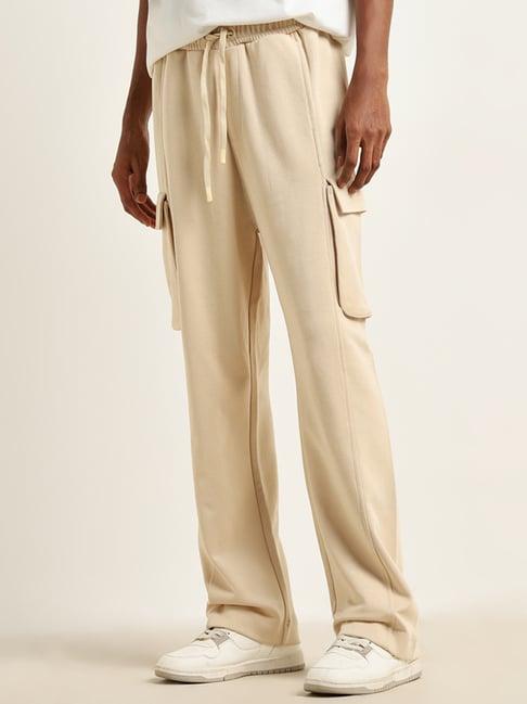 studiofit by westside light beige relaxed-fit mid-rise track pants