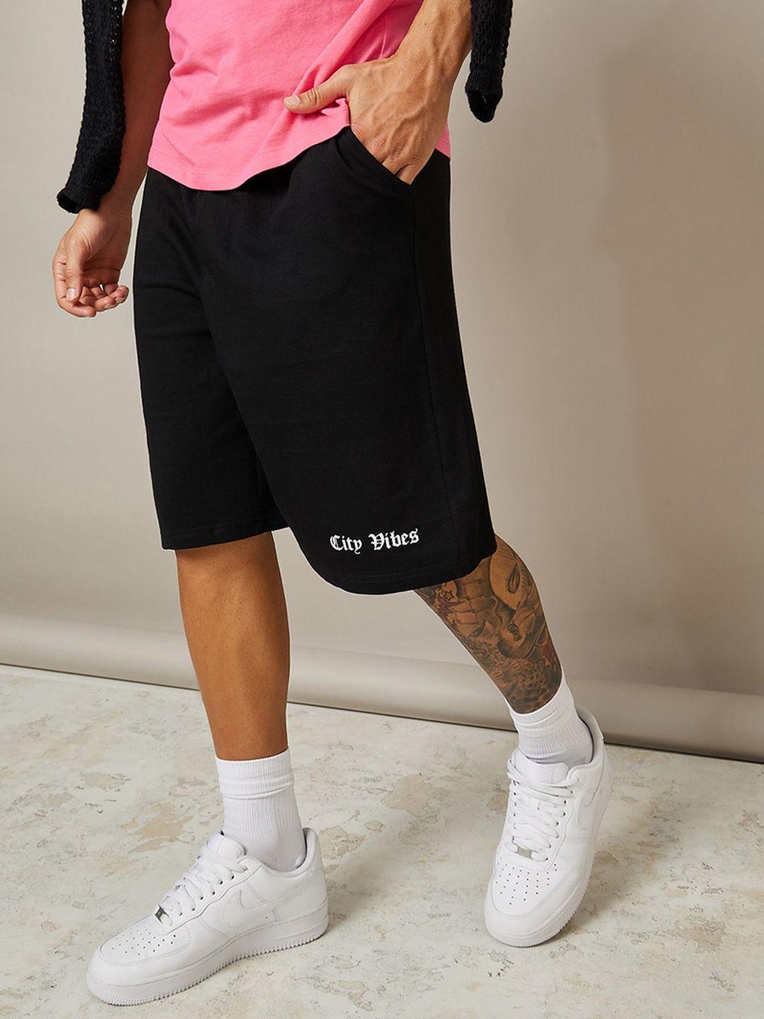 styli men city vibes print oversized shorts