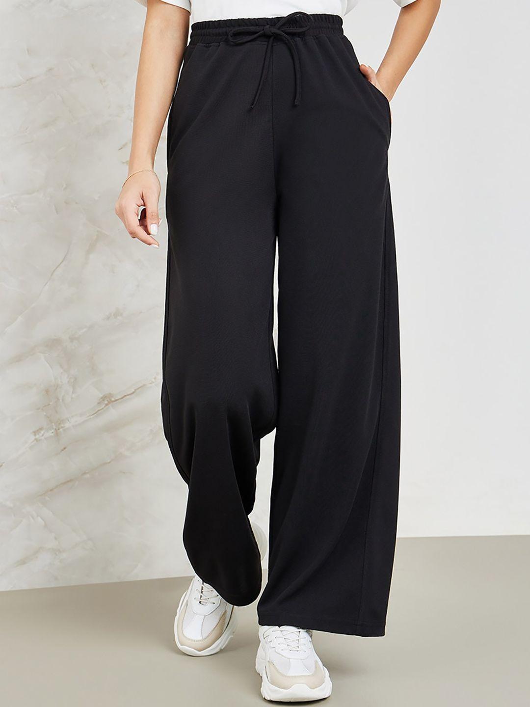 styli women mid rise flared-fit track pants