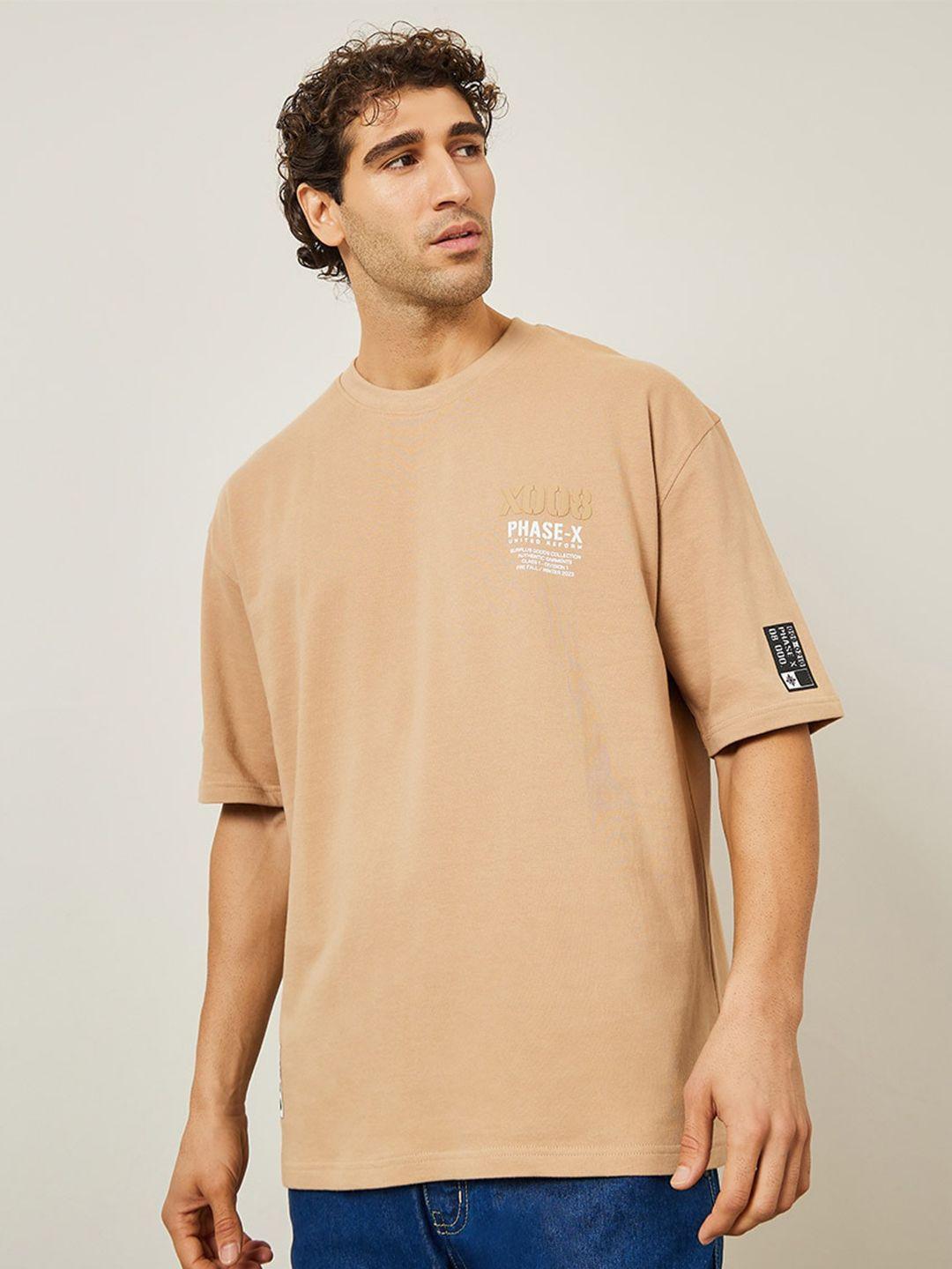 styli beige typography printed round neck terry cotton oversized t-shirt with woven badge