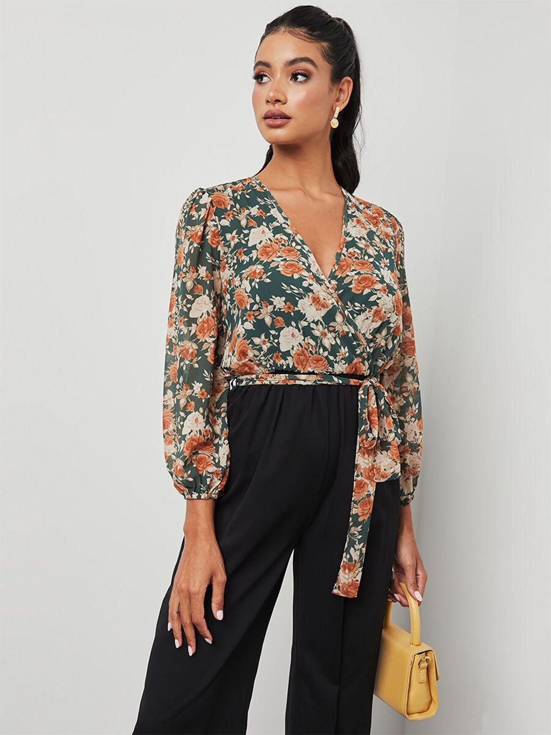 styli green & brown floral print long sleeves jumpsuit with tie belt