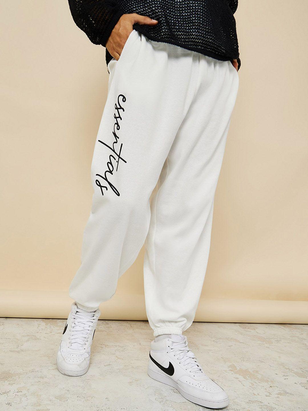 styli men white typography printed oversized cotton joggers with slip pocket