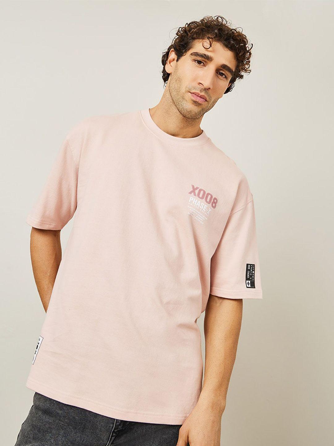 styli pink typography printed round neck cotton terry oversized t-shirt with woven badge