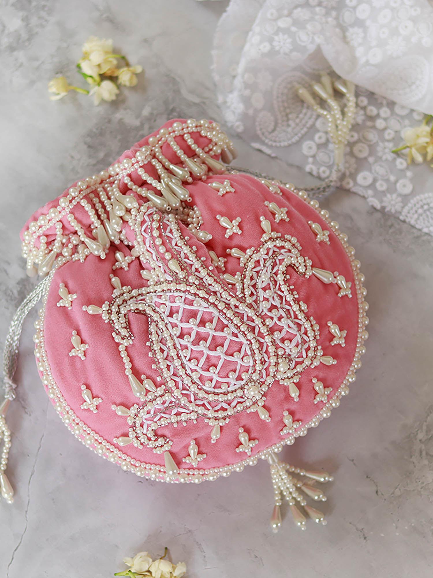 sukoon pink hand embellished potli with pearl handle