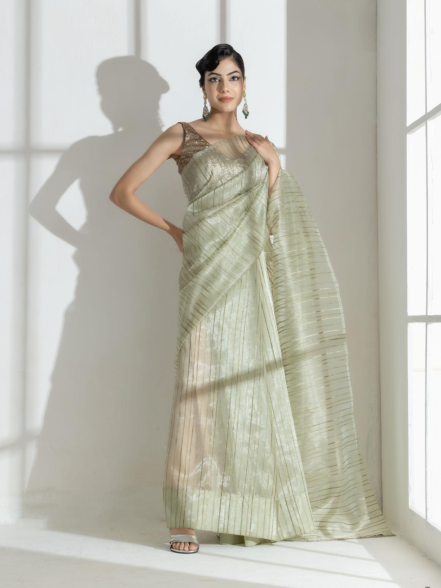 summer green organza saree with self stripes and rainbow lace