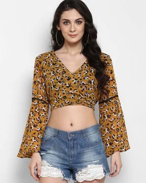 surplice-neck crop top with bell sleeves