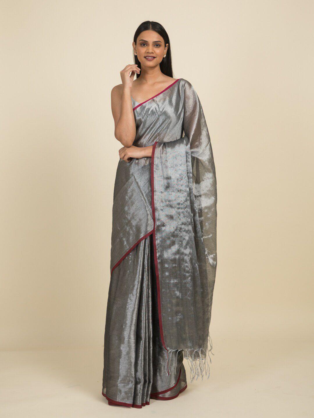 suta black & silver-toned zari saree