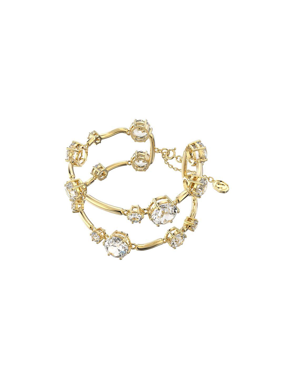 swarovski women white & gold-toned crystals gold-plated bangle-style bracelet