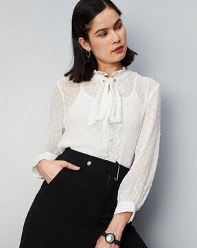 swiss-dot top with puff sleeves