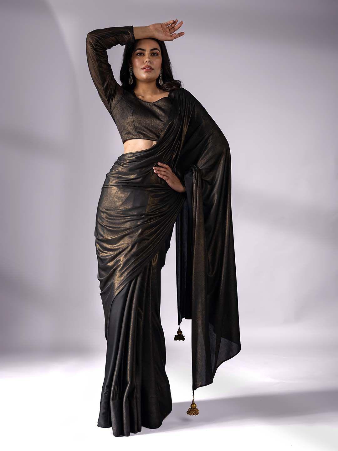 swtantra black knit saree with gold pendants