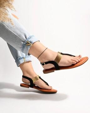 t-strap flat sandals with buckle fastening