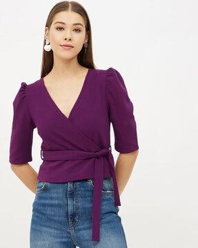 tailored fit wrap-style top with belt