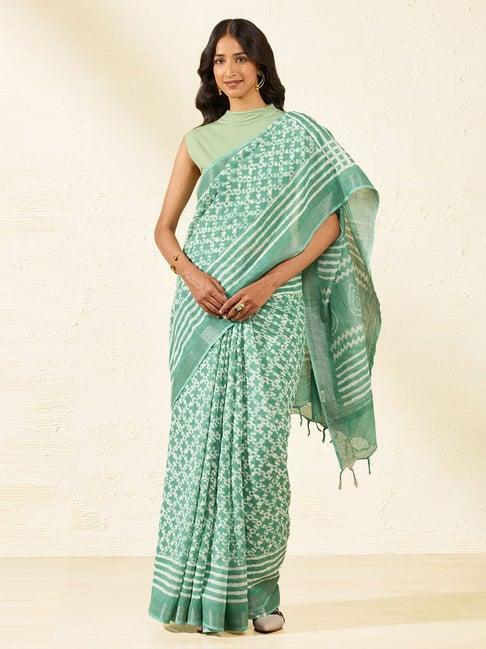 taneira green printed saree with unstiched blouse