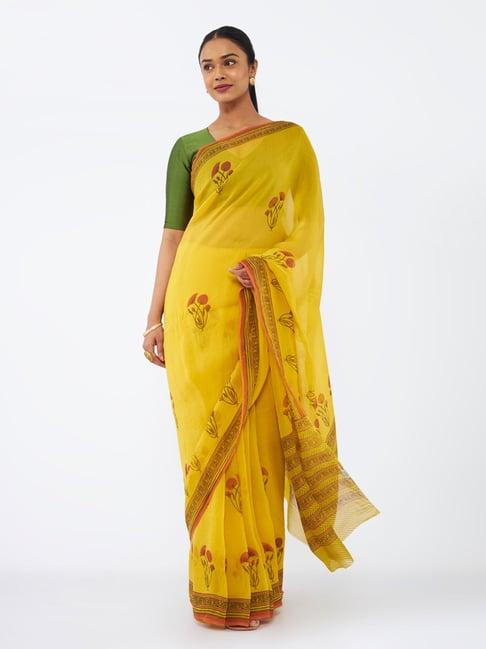 taneira yellow printed saree with unstitched blouse