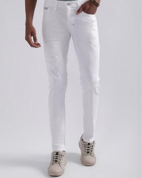tapered fit distressed jeans