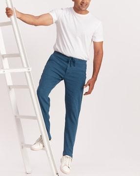 tapered fit flat-front pants