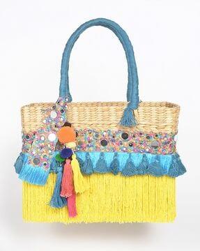 tasseled basket woven cane handbag