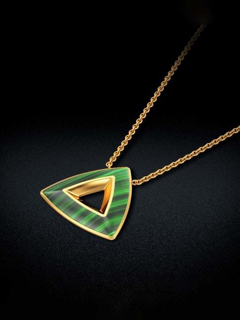 ternion-shaped glowing green gold pendant
