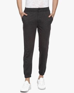 textured mid-rise tapered joggers with pockets