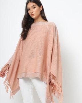 textured poncho with tasselled hems