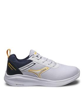 textured sports shoes with lace fastening